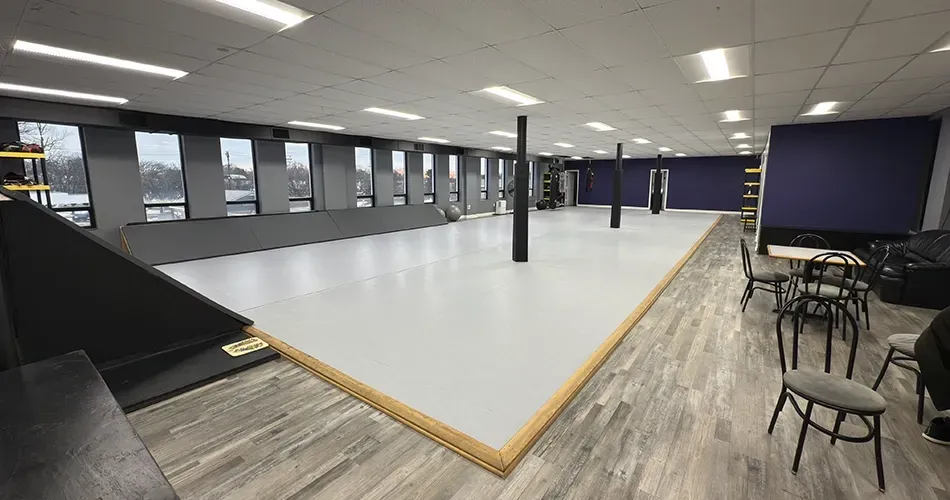 Spacious training facility with clean mats and natural sunlight at Rising Tide MoCo MMA in Rockville, MD